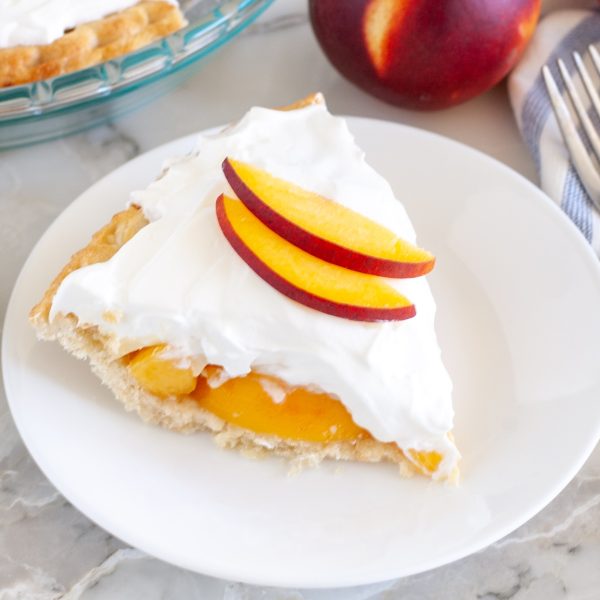 peach cream pie on a plate