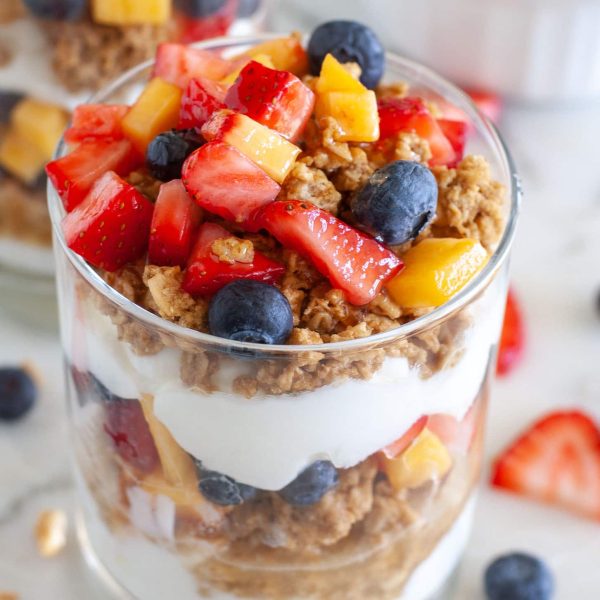 Yogurt parfait in a glass with granola and berries