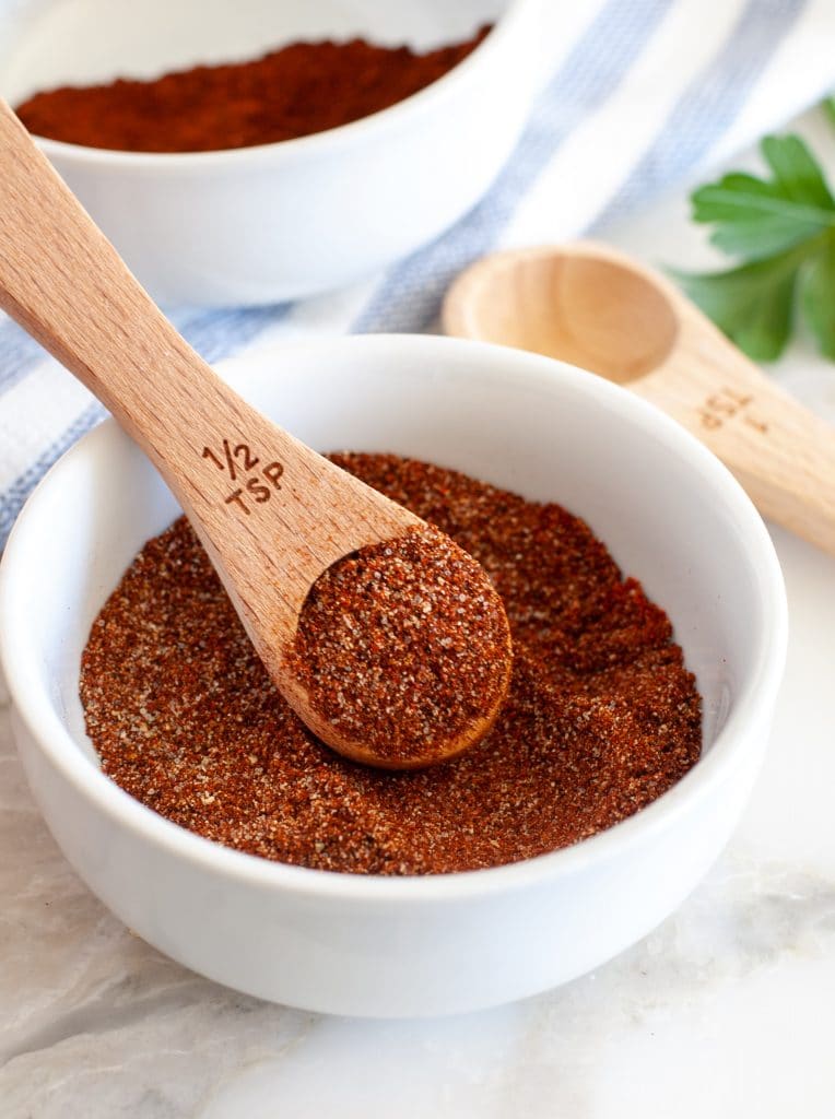 Bowl with chili spice and teaspoon