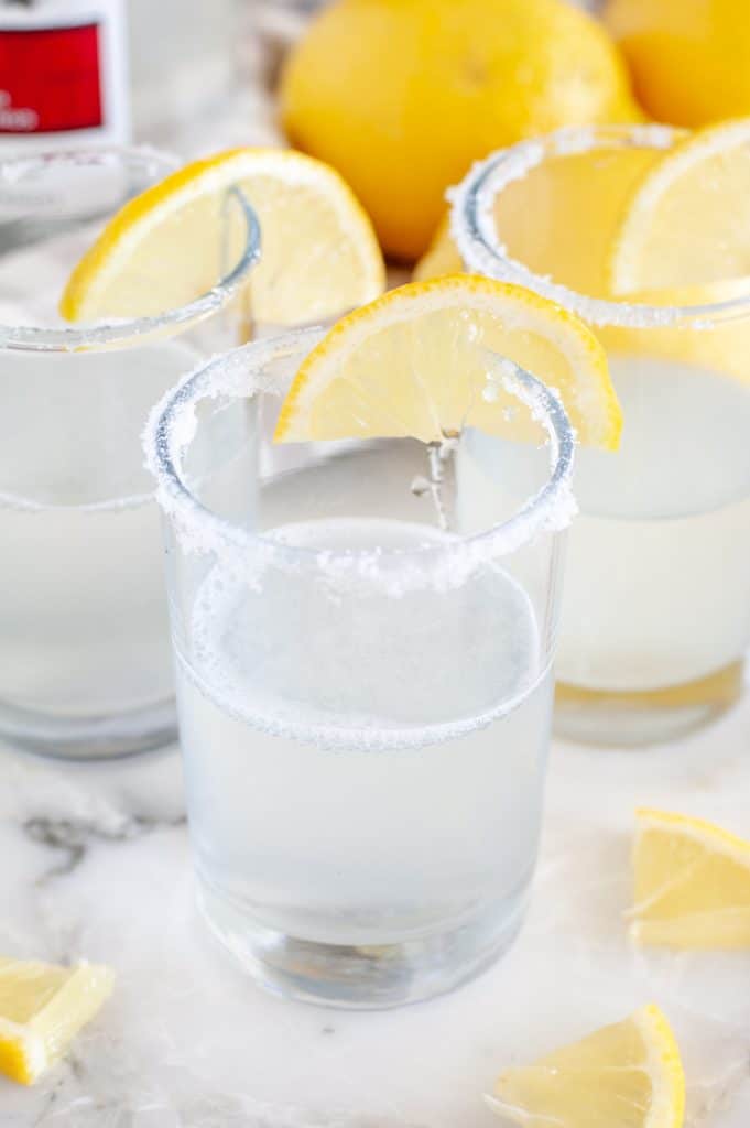 Lemon Drop Shot in shot glass with lemon wedge