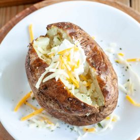 Baked potato with cheese and sour cream