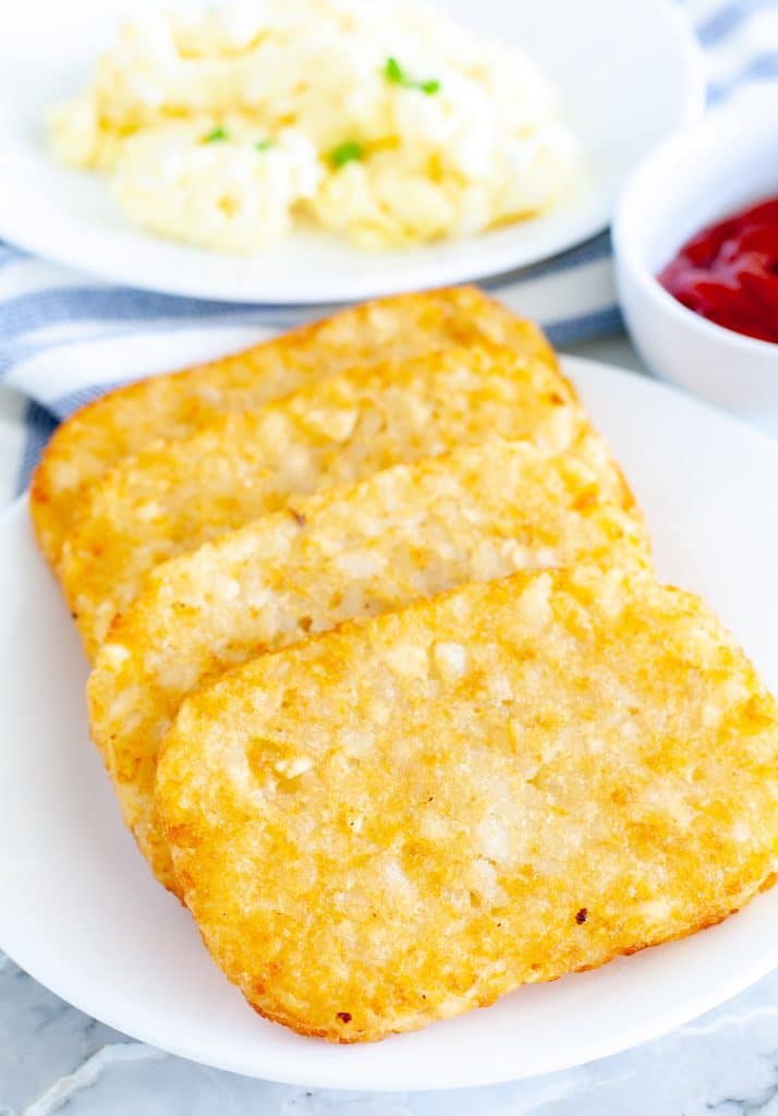 Cooked hash brown patties on a plate