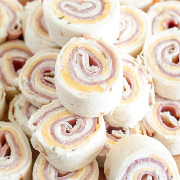 Stack of ham and cheese roll ups.