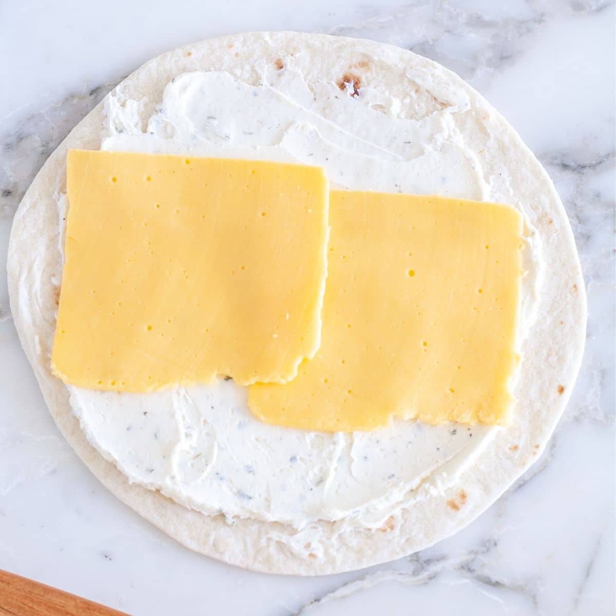 Tortilla with cream cheese and cheese.