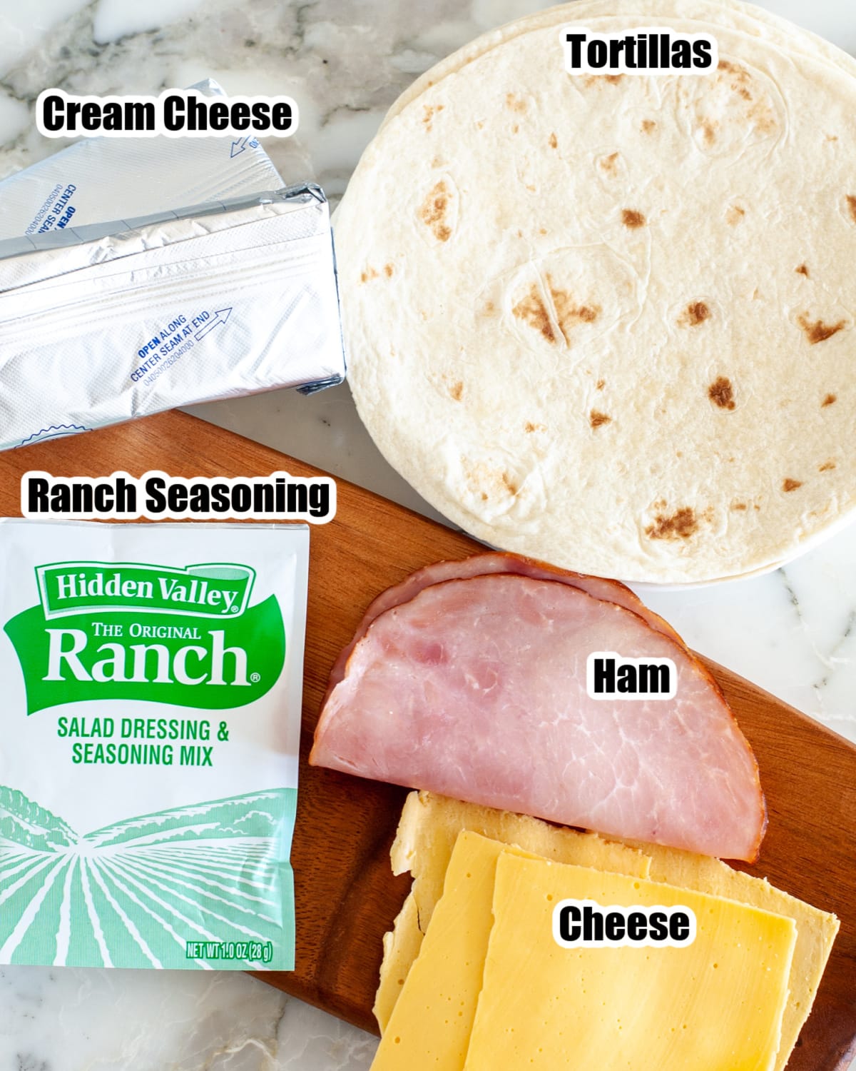 Tortillas, cream cheese, ranch seasonings, ham, and cheese.