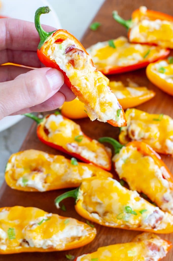 Hand holding stuffed pepper