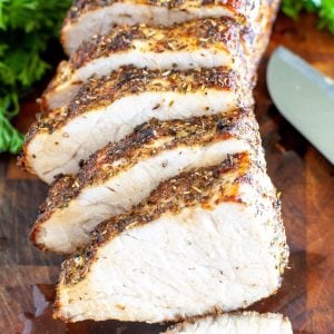 Sliced pork loin on board.