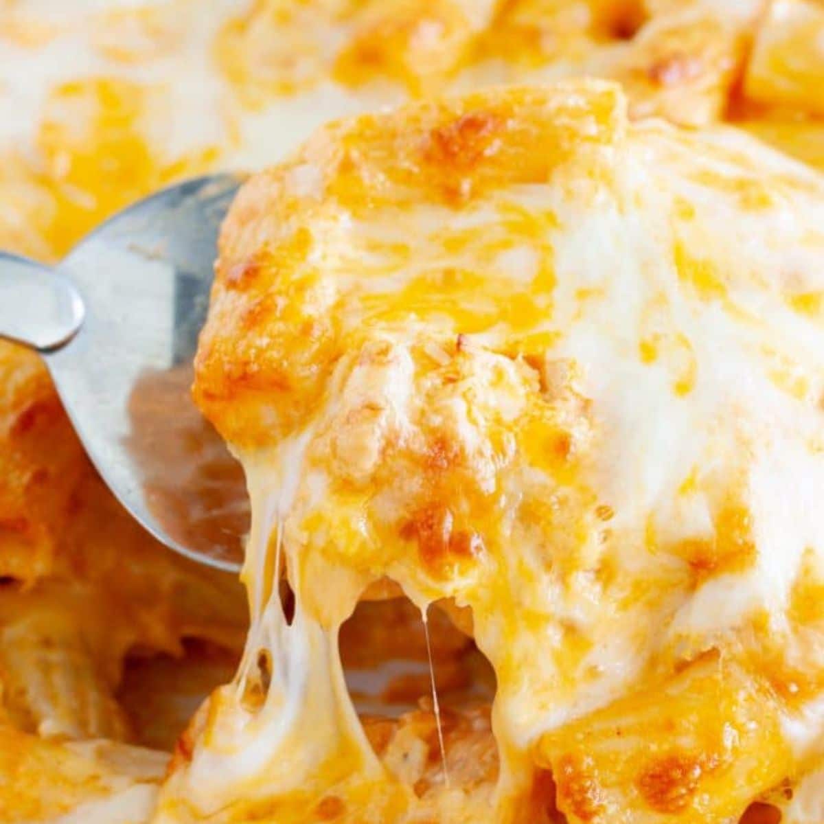 Buffalo chicken pasta with a spatula.