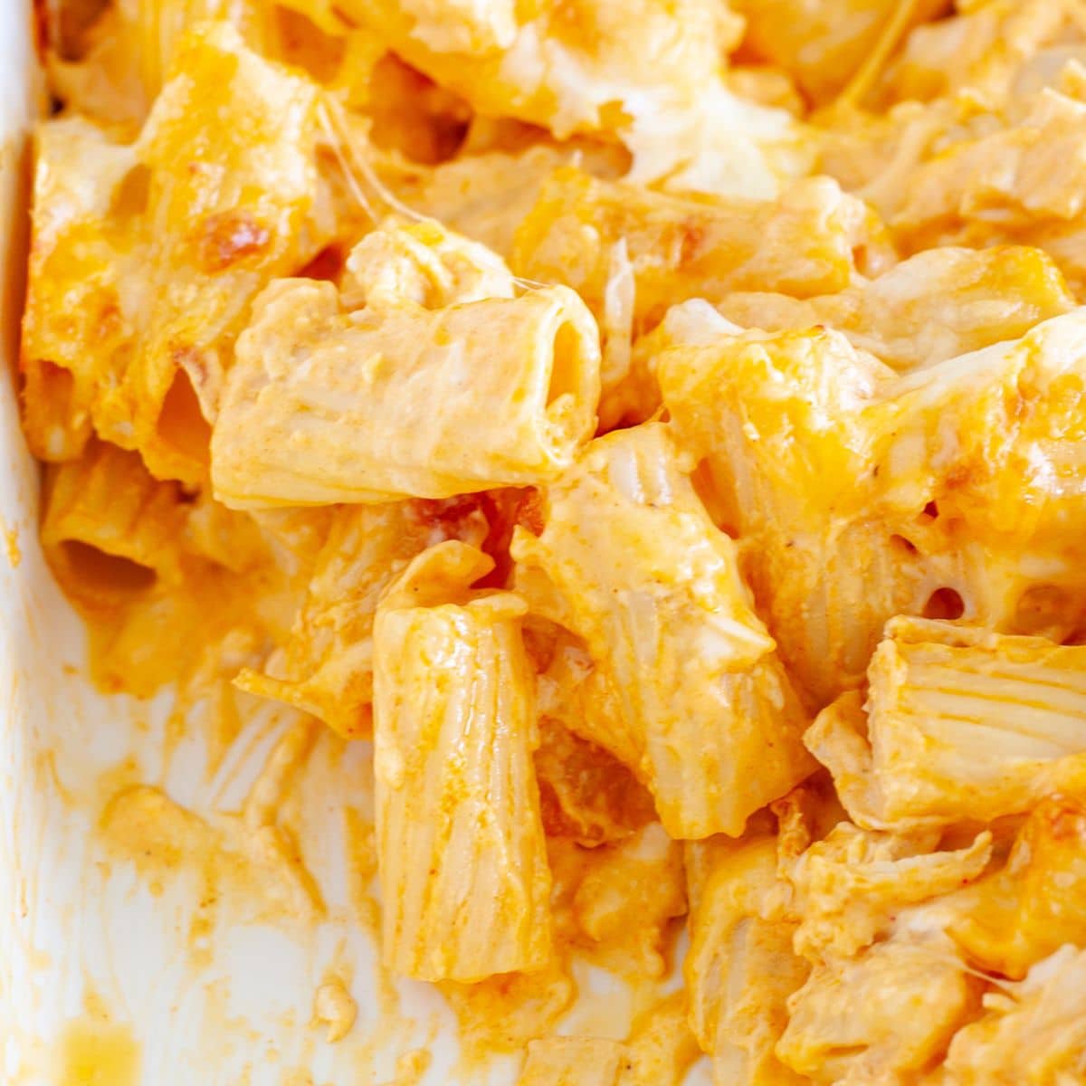 Baked buffalo chicken pasta in a casserole dish.