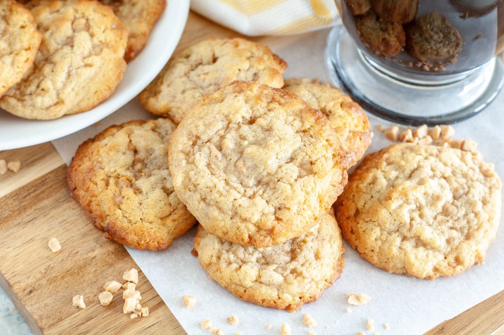 cookies stacked on paper with coffee