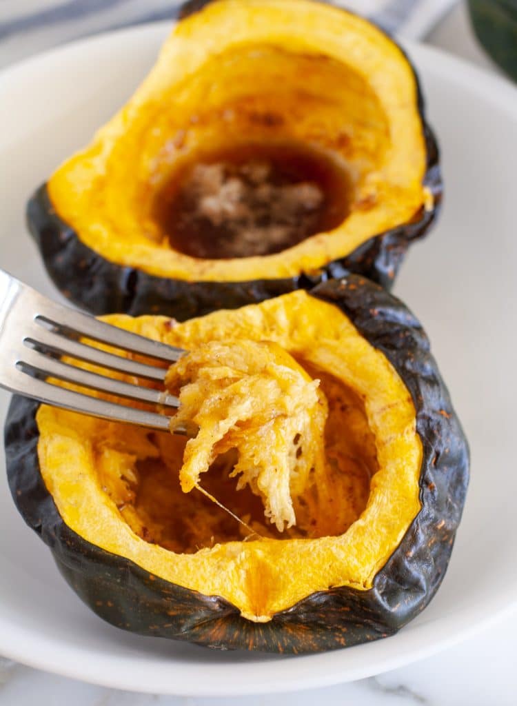Fork scooping up acorn squash