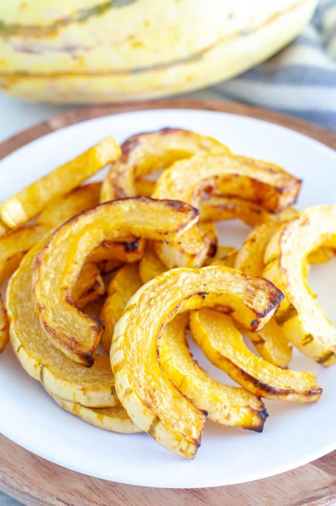 Cooked delicata squash on a plate