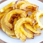 Sliced roasted squash on plate.