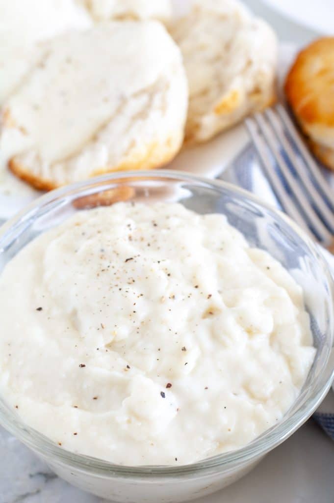 Gravy in a bowl with biscuit