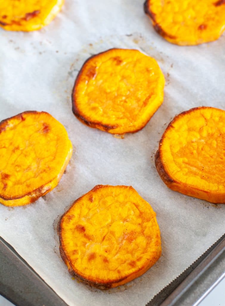 Sliced sweet potatoes on a pan