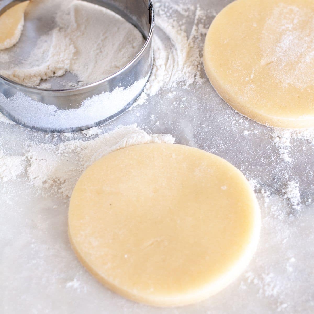 Unbaked sour cream cookie on baking sheet. 