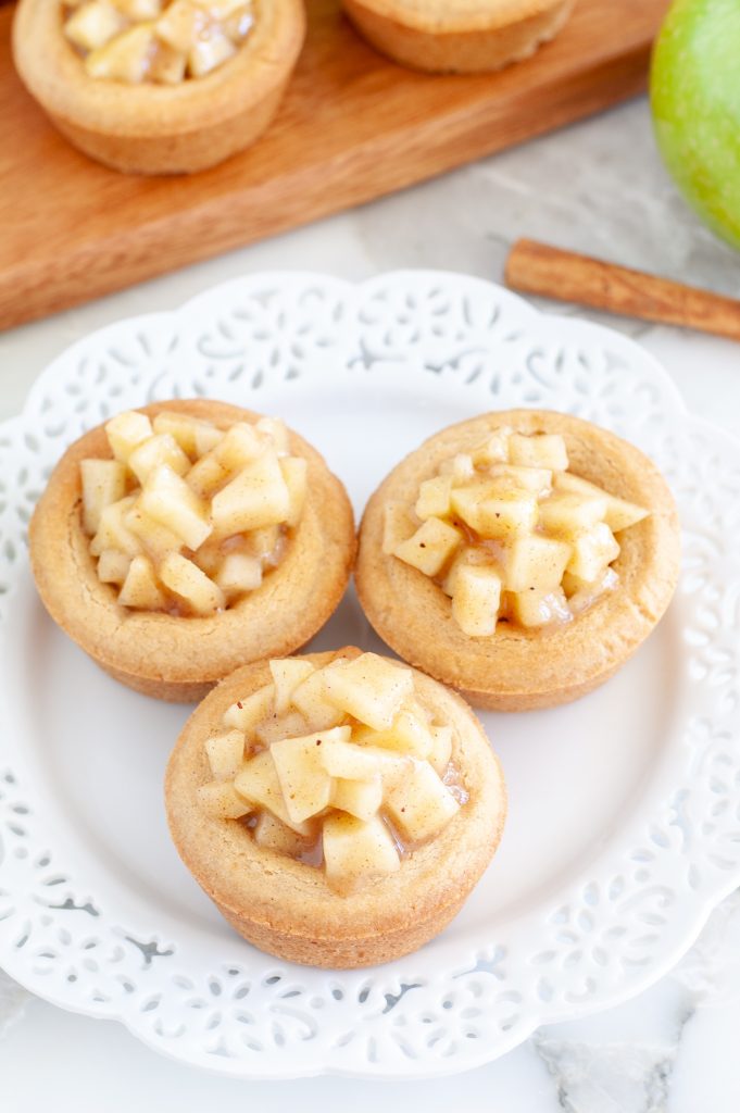 Cookie cups with apples on a plate