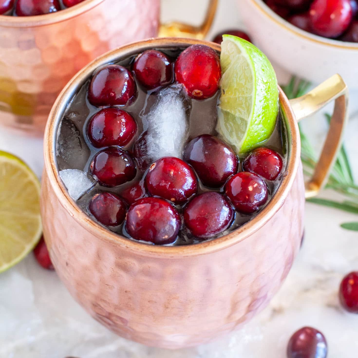 Moscow Mule in a copper cup with cranberries