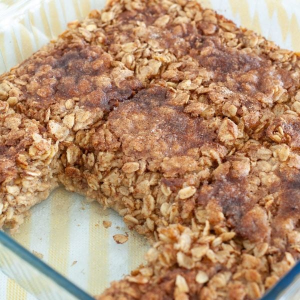 Oatmeal in baking dish with piece missing.