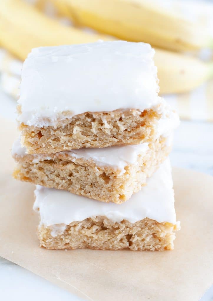 Three blondies stacked on counter. 