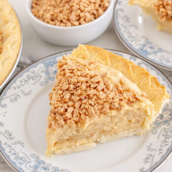 Slice of butterscotch pie on plate.