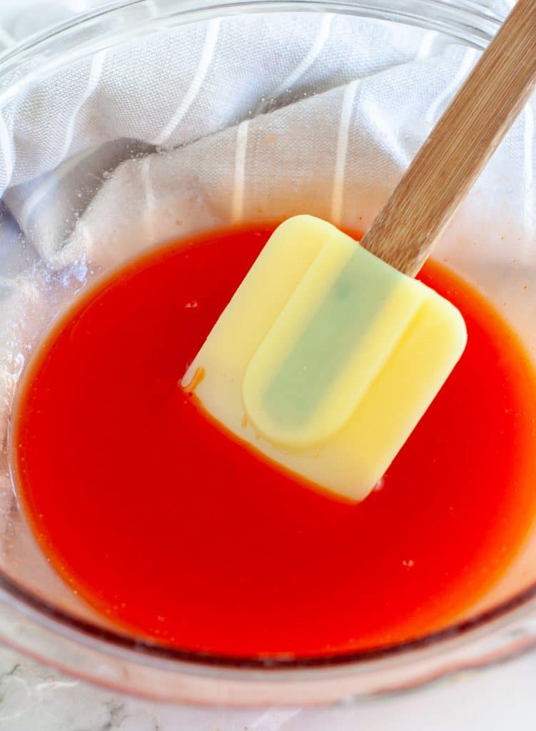 Bowl of sauce with spatula. 