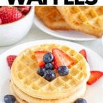 Waffles on plate with berries.