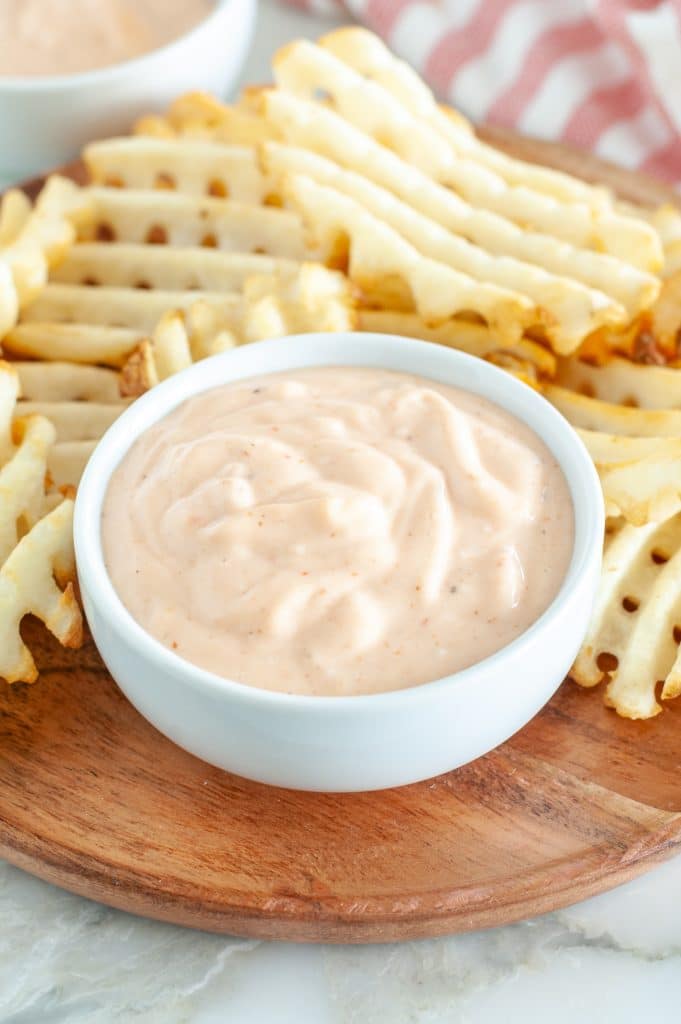 Bowl of fry sauce with waffle fries.