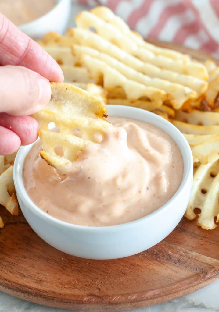 Waffle fry with sauce. 