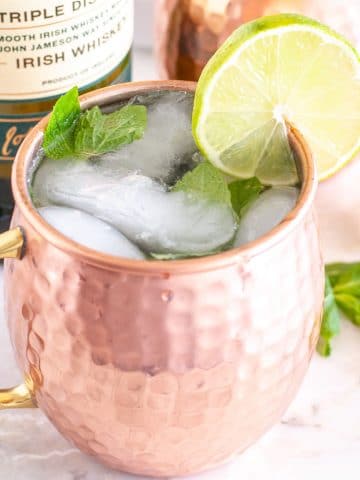 Copper cup with a lime slice.