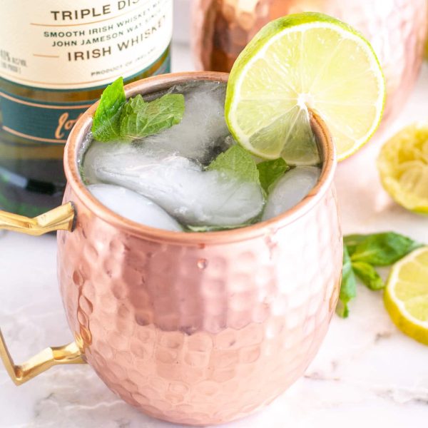 Copper cup with a lime slice.