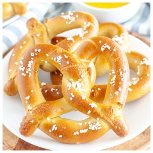 Soft pretzels on plate.