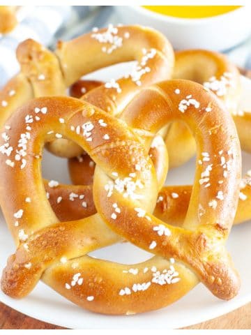 Soft pretzels on plate.
