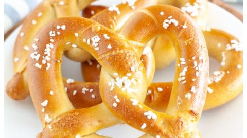 Soft pretzels on plate.