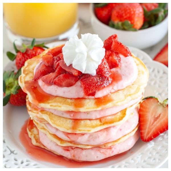 Stack of pancakes with strawberries.