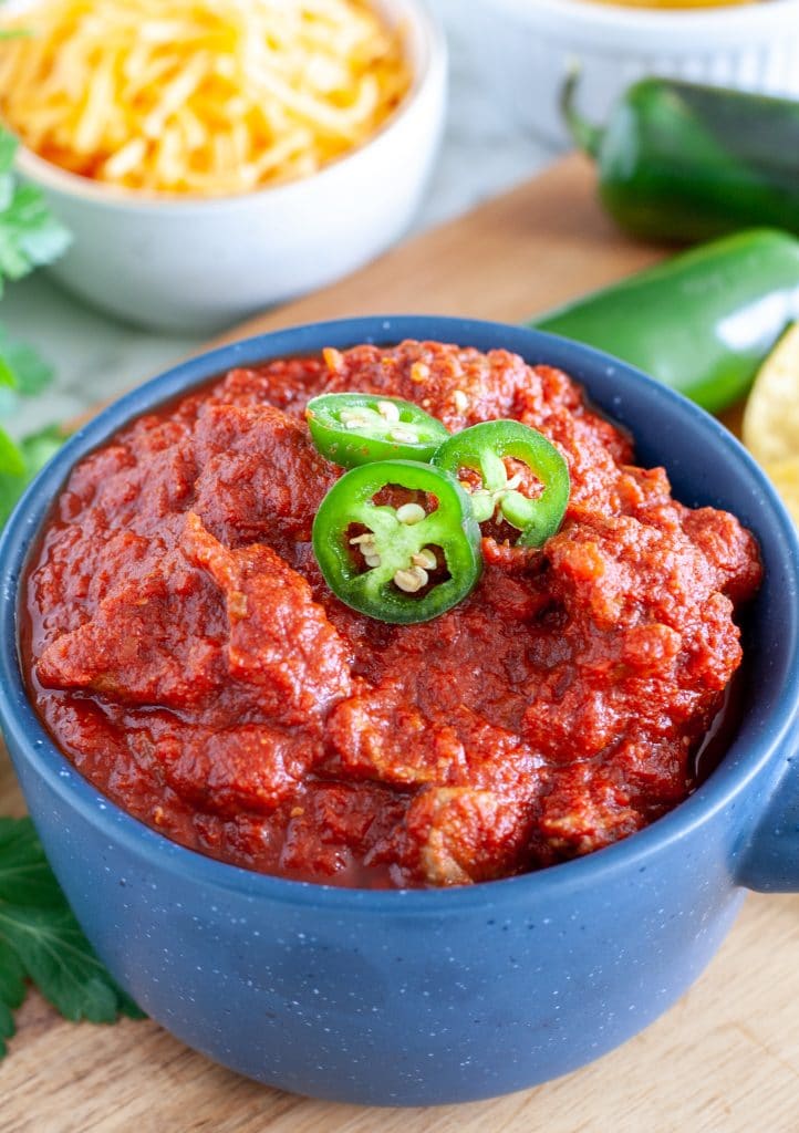 Blue bowl with chili and jalapenos. 