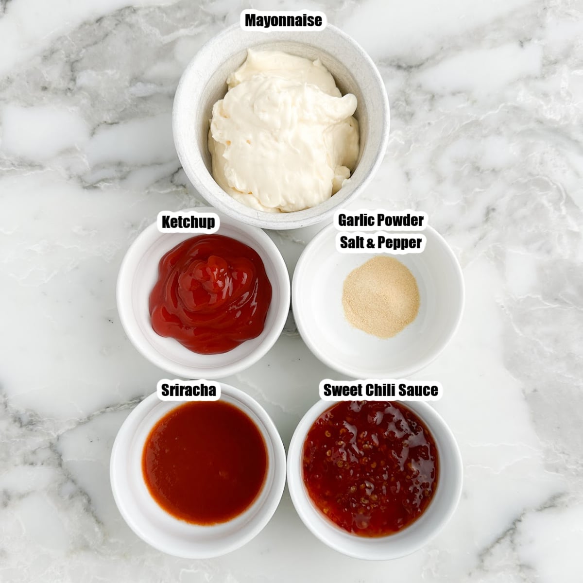 Bowls of mayonnaise, sriracha, sweet chili sauce, and ketchup. 