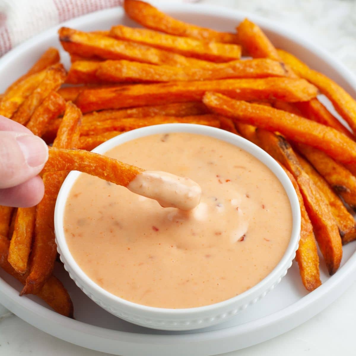 Sweet potato fries with a bowl of boom boom sauce.