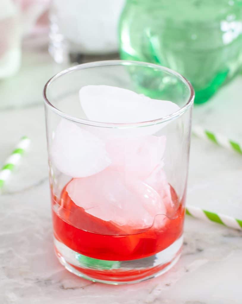 Glass with maraschino juice and ice. 