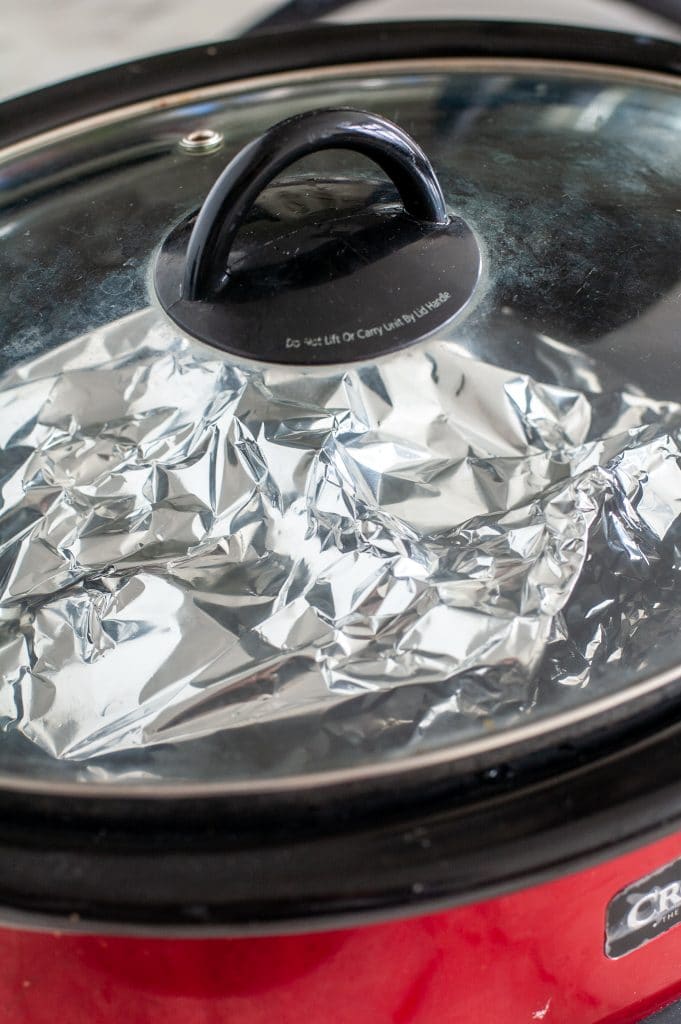 Chicken wrapped in foil in slow cooker. 