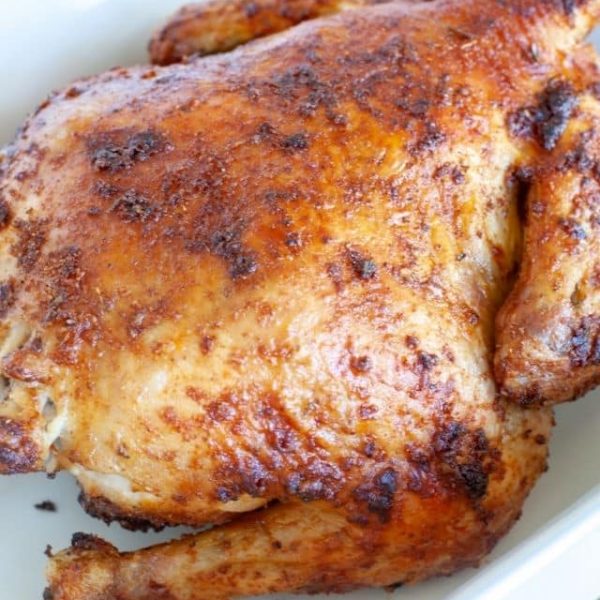 Whole chicken in a baking dish.