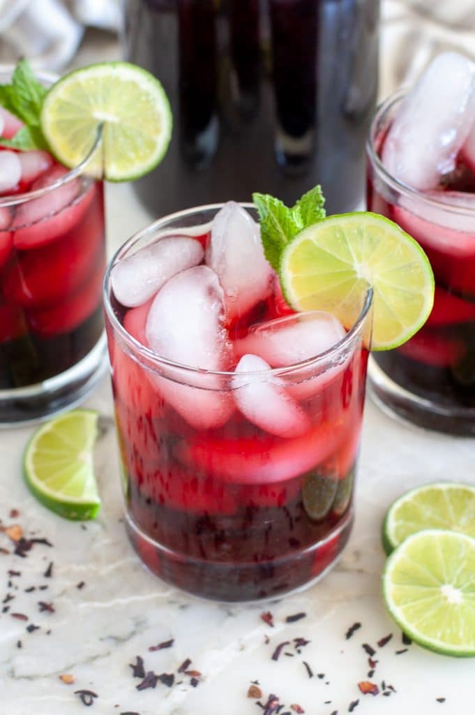 Glass of red tea with lime slice. 