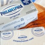 Block of cream cheese on plate.
