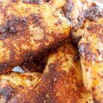 Seasoned chicken wings on a plate