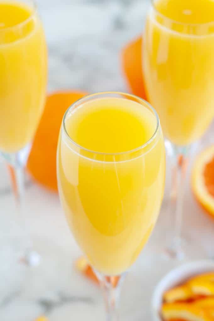 Champagne flute with orange juice.