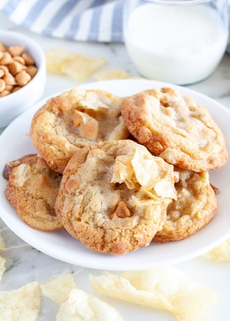 Plate of cookies with bowl of butterscotch chips. 