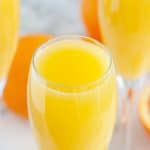 Glasses filled with orange juice.