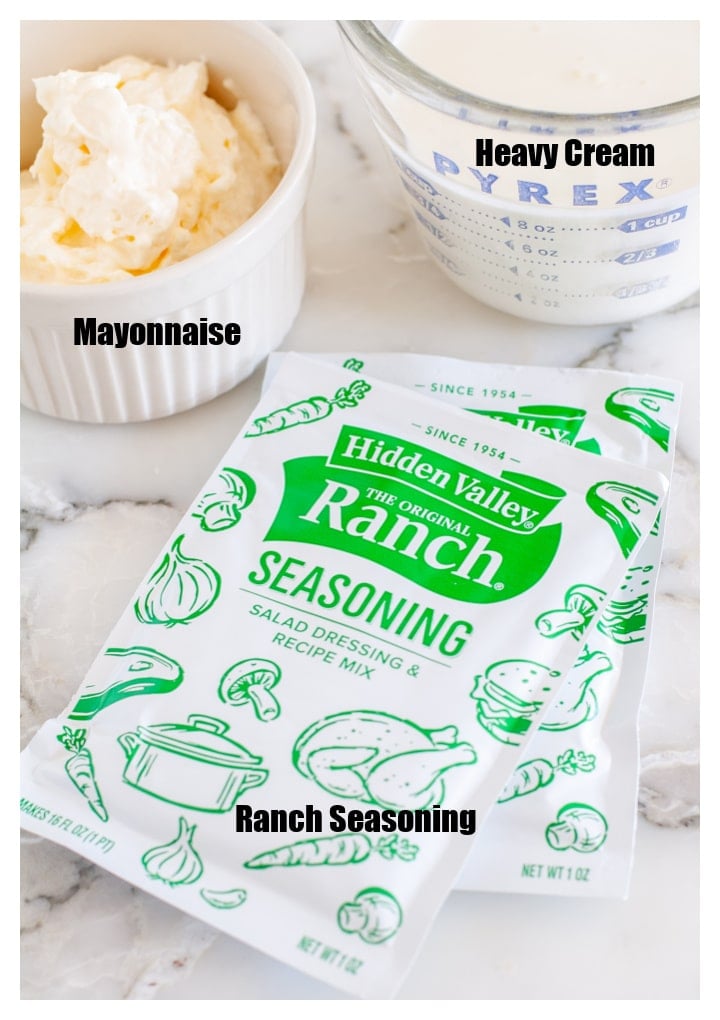 Packets of ranch seasoning, bowl of mayo and heavy cream. 