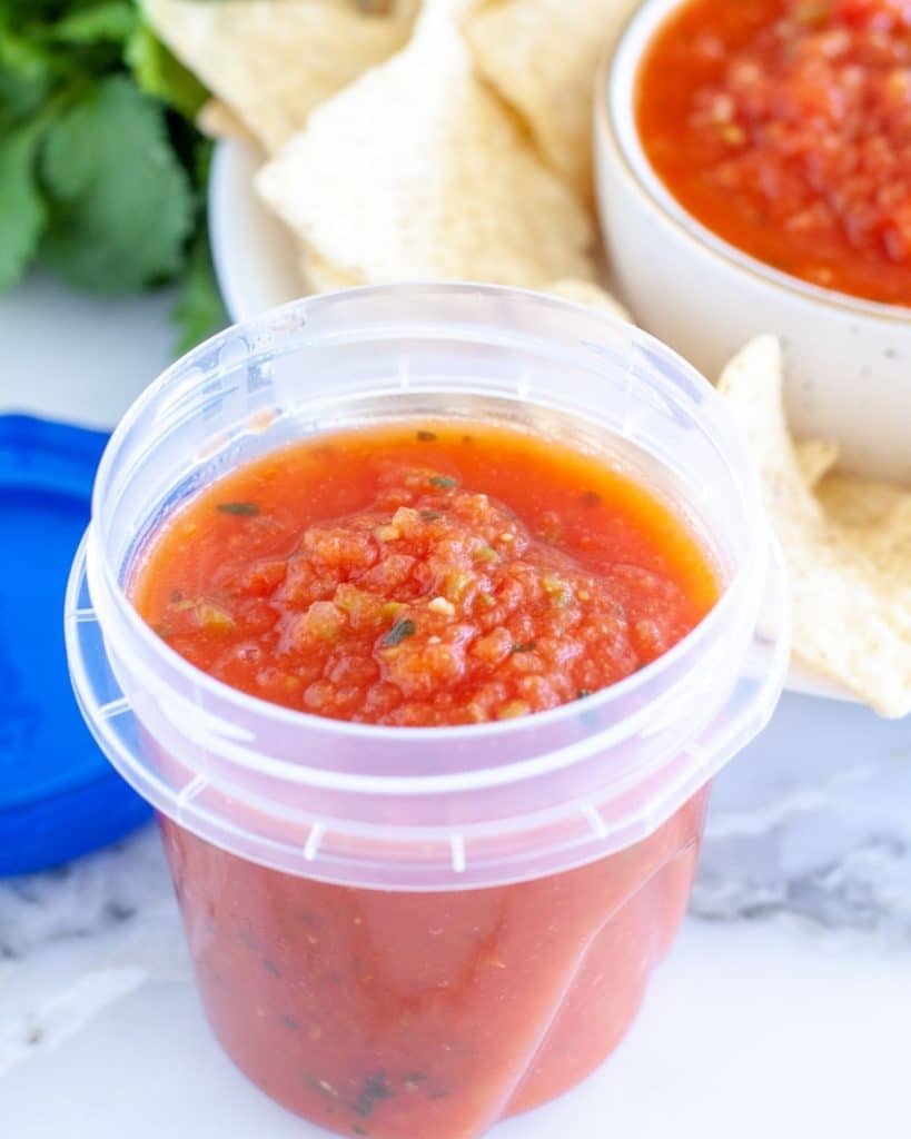 Container with salsa.