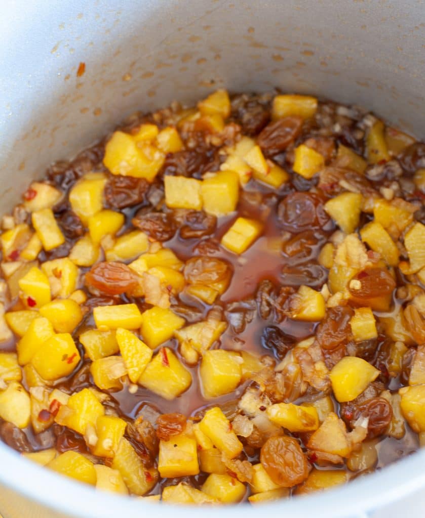 Pot with diced peaches and raisins. 